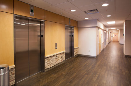 Photo of elevators and a hallway at the Parker Professional Building.
